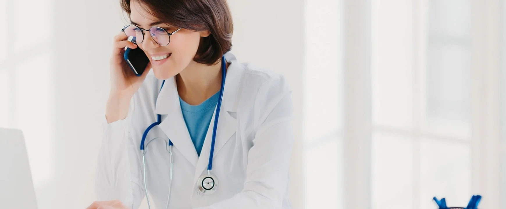 Clinical research physician speaking by phone